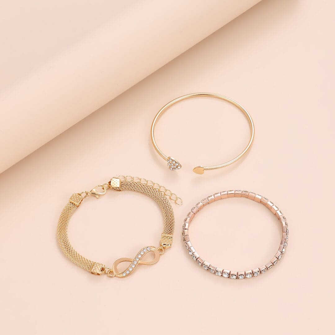 A set of three bracelets on top of a table.